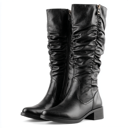 Damskie kozaki za kolano na niskim obcasie zapinane na zamek.